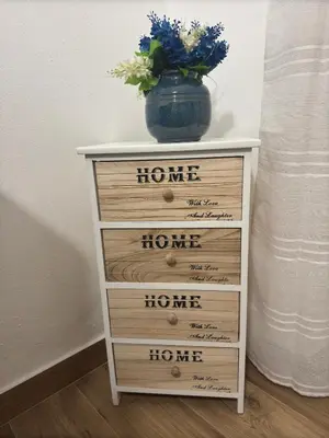 a dresser with a blue vase on top of it at Mortillaro 19 in Palermo