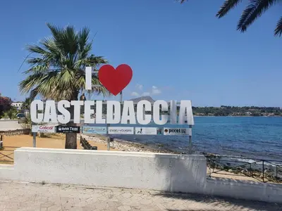 a sign on a beach with a red heart at Ariel e Giangy Home in Casteldaccia