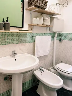 a bathroom with a sink and a toilet at Quattru Passi in Palermo