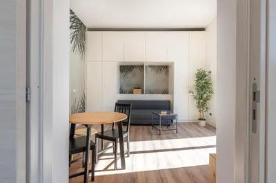 a dining room with a table and chairs at Turati Apartment al Politeama by Wonderful Italy in Palermo