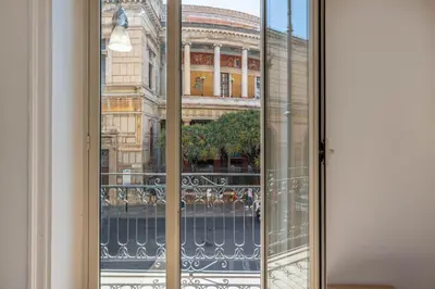 a glass door with a view of a building at Turati Apartment al Politeama by Wonderful Italy in Palermo