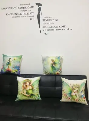 a black couch with three pillows on it at Mermaid Space Capsule Hostel Palermo in Palermo