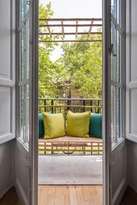 a window with a couch on a balcony at Libertà Appartement in Palermo