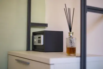 a microwave sitting on top of a dresser with a vase at Vissi d'Arte Rooms in Palermo