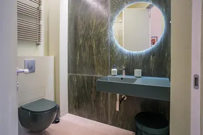 a bathroom with a sink and a mirror at Vissi d'Arte Rooms in Palermo