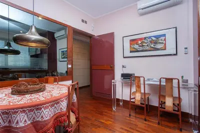 a dining room with a table and some chairs at Casa Adele in Palermo