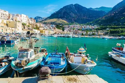a group of boats are docked in a harbor at Casa Mary in Castellammare del Golfo