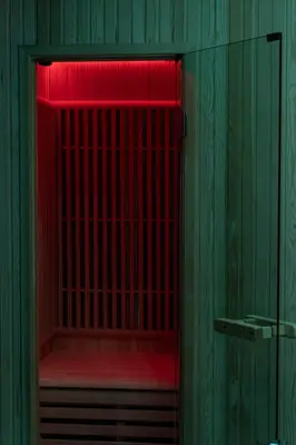 a hotel room with a bed and a salon at Dea Suite in Bagheria