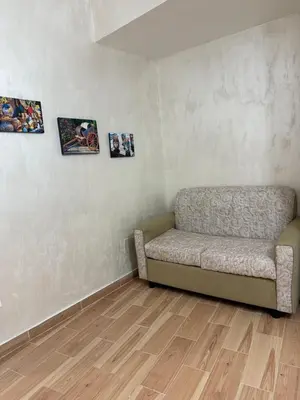 a living room with a bed and a couch at monteleone centro apartment in Palermo