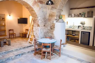 a kitchen with a table and a refrigerator in a room at Duplex Townhouse with Gigantic Terrace in Palermo