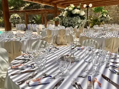 a table set up for a wedding with wine glasses at Agriturismo Tenute Pispisa Segesta in Calatafimi