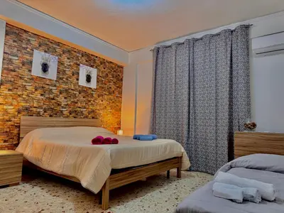 a bedroom with a bed and a brick wall at Casa Vacanze La Dolce Vita in Terrasini