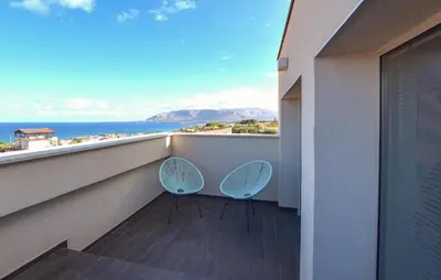 two chairs on a balcony with a view of the ocean at Amazing Home In Balestrate With Wifi in Balestrate