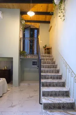 a stairway in a house with a stair case at Normanni Underground in Palermo