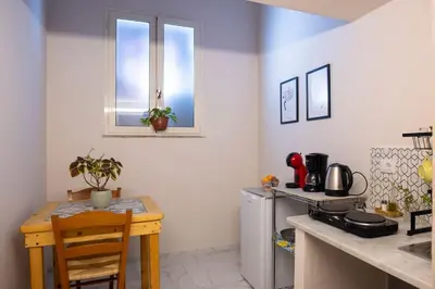 a kitchen with a table and a counter top at Normanni Underground in Palermo