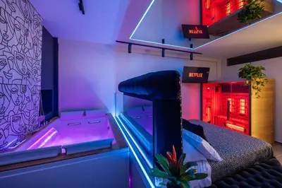 a room with a fish tank in a bedroom at D'ossuna66 Suite & Spa in Palermo
