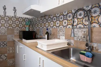 a kitchen with a sink and a counter with a sink at Tra i vicoli di Ballarò in Palermo