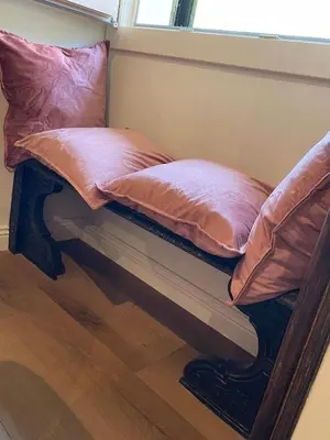 two pillows sitting on a bench in a room at Soldano luxury apartment in Palermo