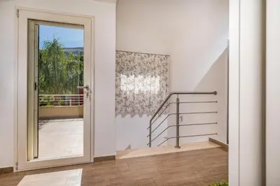 a room with a door leading to a balcony with stairs at Borgo Aranci - Villa Nicales in Castellammare del Golfo