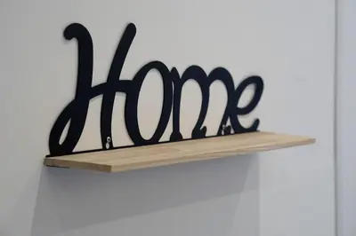 a black sign on a shelf on a wall at 27 Apartaments Palermo in Palermo