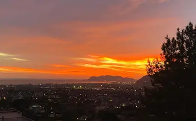 a sunset over the city of cape town at Casale di Sicilia in Monreale