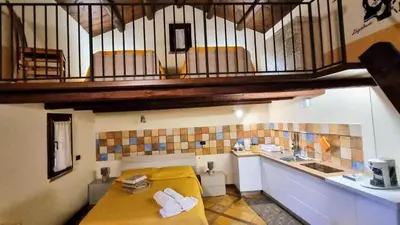 a room with a bed and a sink and a staircase at Casale di Sicilia in Monreale