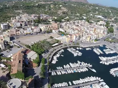 an aerial view of a harbor with boats at Il giardino degli ulivi in Trabia