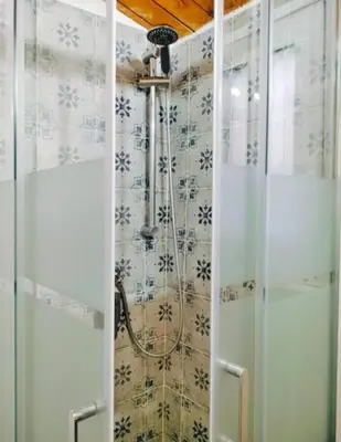 a shower in a bathroom with a shower curtain at La Casetta al Cassaro in Palermo