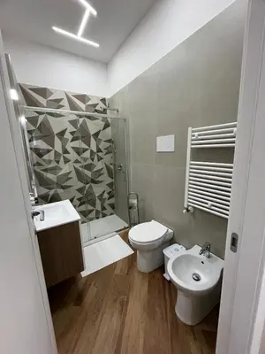a bathroom with a toilet and a sink and a shower at Casa Miriam 281 in Palermo