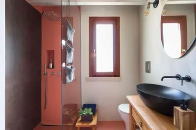 a bathroom with a black sink and a shower at Villa Zingaro Cala Bianca in Castellammare del Golfo
