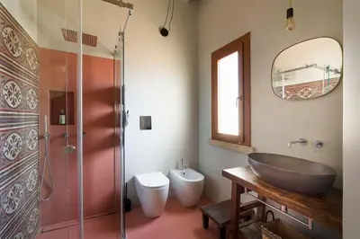 a bathroom with a sink and a glass shower at Villa Mori Cala Bianca in Castellammare del Golfo