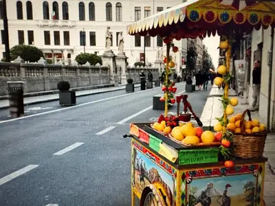 a fruit stand on the side of a street at Daniel's Winter in Palermo