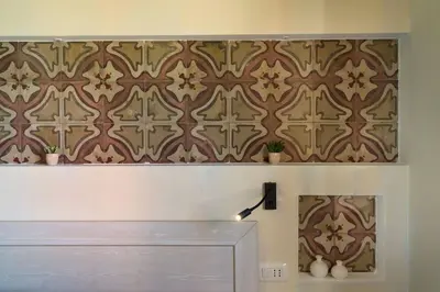 a wall with a brown and white patterned wall at Villa Disa Cala Bianca in Castellammare del Golfo