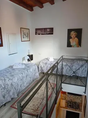 a room with two beds and a glass staircase at Accademia in Palermo