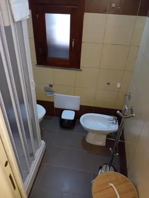 a small bathroom with a toilet and a sink at Accademia in Palermo