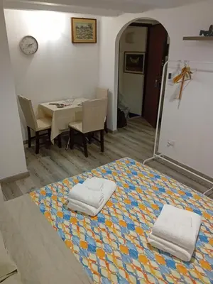 a room with a bed with two towels on it at Accademia in Palermo