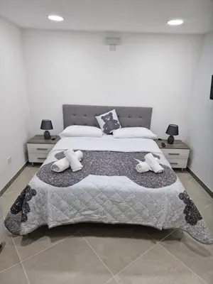a bedroom with a bed with two stuffed animals on it at Rosselli house 5 in Palermo