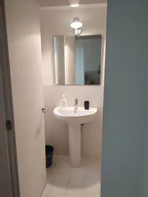 a bathroom with a sink and a mirror at Loft in Vucciria in Palermo