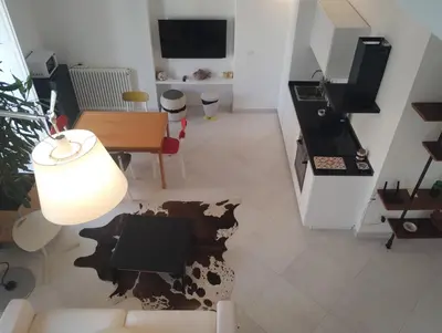 a living room with a cow cut out on the floor at Loft in Vucciria in Palermo