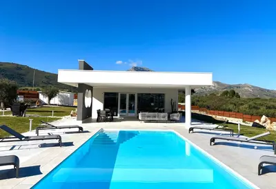 a villa with a swimming pool and a house at Villa Nanni Contemporary, Pool and Garden in Castellammare del Golfo