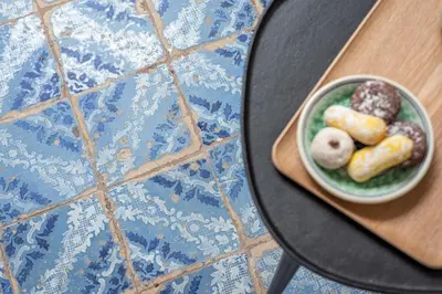 a bowl of donuts on a plate on a table at La casa nel baglio in Palermo