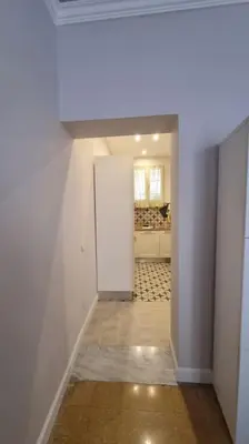 a hallway with a white door in a room at L'ùoro Apartment in Carini