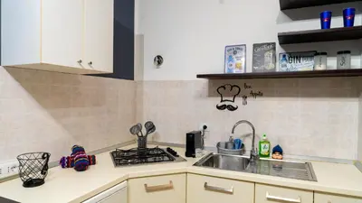 a small kitchen with a sink and a stove at La Casetta di Ale - By Rental BeB Italy - in Palermo