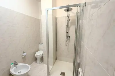 a bathroom with a shower and a toilet at La Casetta di Ale - By Rental BeB Italy - in Palermo