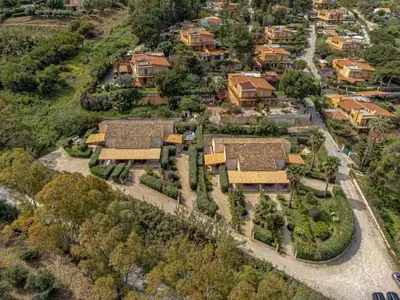 an aerial view of a house in a village at Villa Berretta by Sicily Travelling Villas in Scopello
