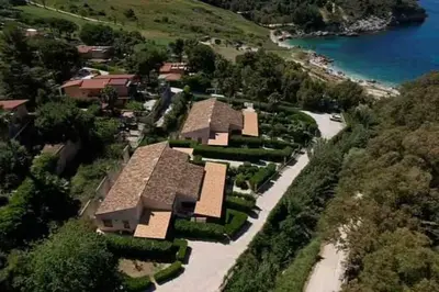 arial view of a house on a hill near the water at Villa Uzzo by Sicily Travelling Villas in Scopello