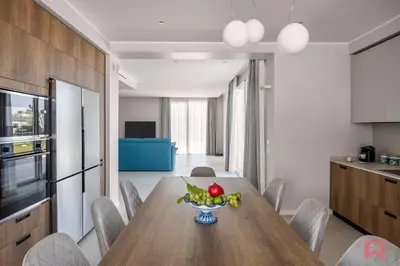 a dining room with a table with a bowl of fruit at Brand New Villa with Private Heated Pool in Terrasini