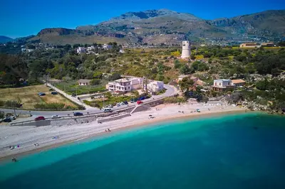 an aerial view of a beach and the ocean at Le Residenze di Zio Toto' in Scopello
