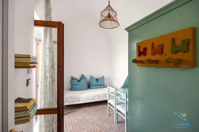 a mirror reflection of a room with a couch at Verosicily Villa Damus in Terrasini