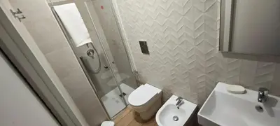 a bathroom with a shower and a toilet and a sink at Cozy Apartment with Stunning Mountain Views in Lascari